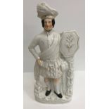 A collection of thirteen various Staffordshire figures including "Rob Roy", 47 cm high,