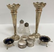 A pair of silver sheathed trumpet shaped stem vases, 20.