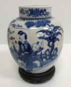 A 19th Century Chinese blue and white ginger jar and cover decorated with figures playing music and