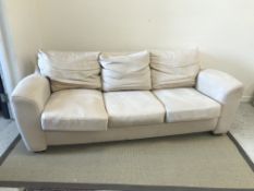 A modern cream faux suede upholstered three piece suite, sofa 212 cm wide, chairs 100 cm wide,