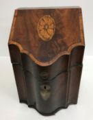 A George III mahogany and inlaid slope top knife box of serpentine form,