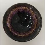 A carved bluejohn bowl with flared rim, raised on a circular foot, 7 cm diameter x 2.