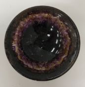 A carved bluejohn bowl with flared rim, raised on a circular foot, 7 cm diameter x 2.