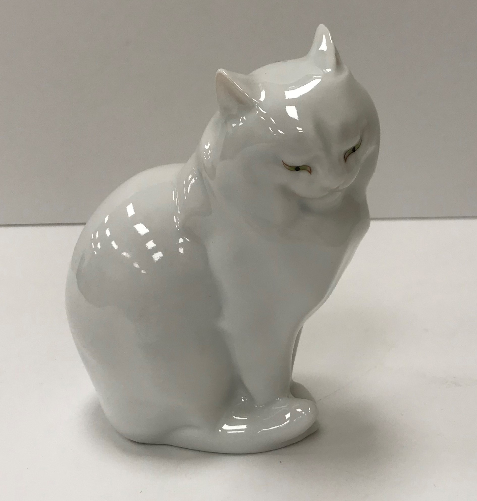 A Herend blanc de chine figure of a "Seated cat" (214), 12 cm high,