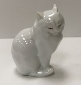 A Herend blanc de chine figure of a "Seated cat" (214), 12 cm high,