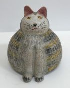 A collection of ten various pottery and wooden cat ornaments, including one by Mike Hinton,