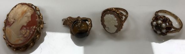 Two Victorian 9 carat gold rings, one with cameo, the other garnet and pearl set,
