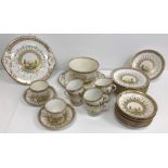 A 19th Century English china part tea set comprising twelve cups and twelve saucers, slop bowl,