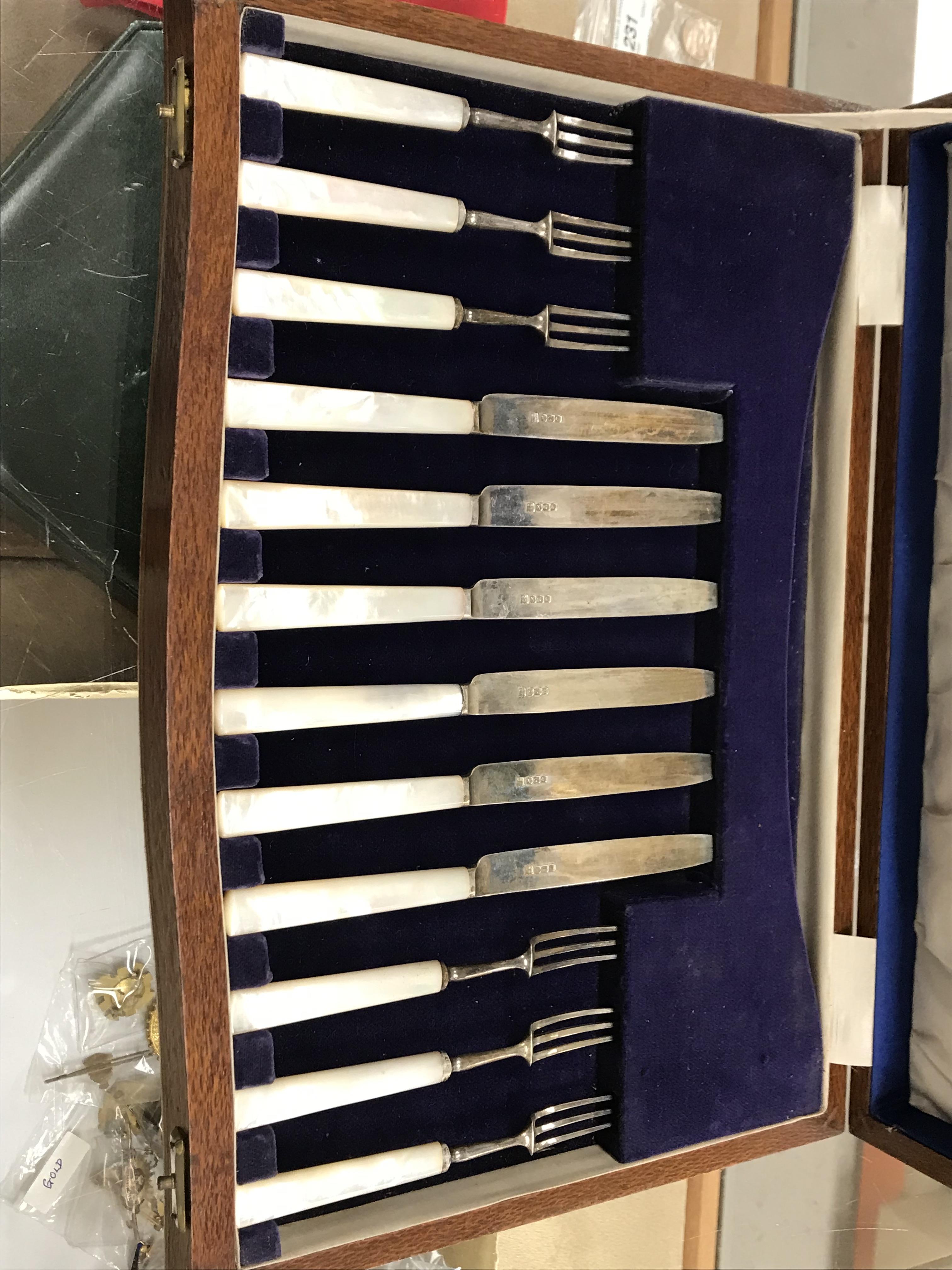 A cased set of six silver bladed and tined mother of pearl handled fruit knives and forks (by James - Image 24 of 26