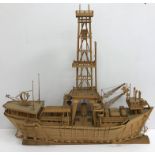 A 20th Century bamboo model of a drilling rig ship/boat with central rig and helicopter landing pad,