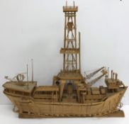 A 20th Century bamboo model of a drilling rig ship/boat with central rig and helicopter landing pad,