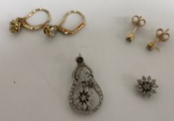 A pair of diamond solitaire drop earrings, each 0.