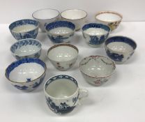 A collection of Oriental and English mainly blue and white tea bowls and cups to include a