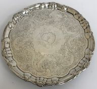 A George II silver salver with later foliate engraved decoration and pie-crust rim,