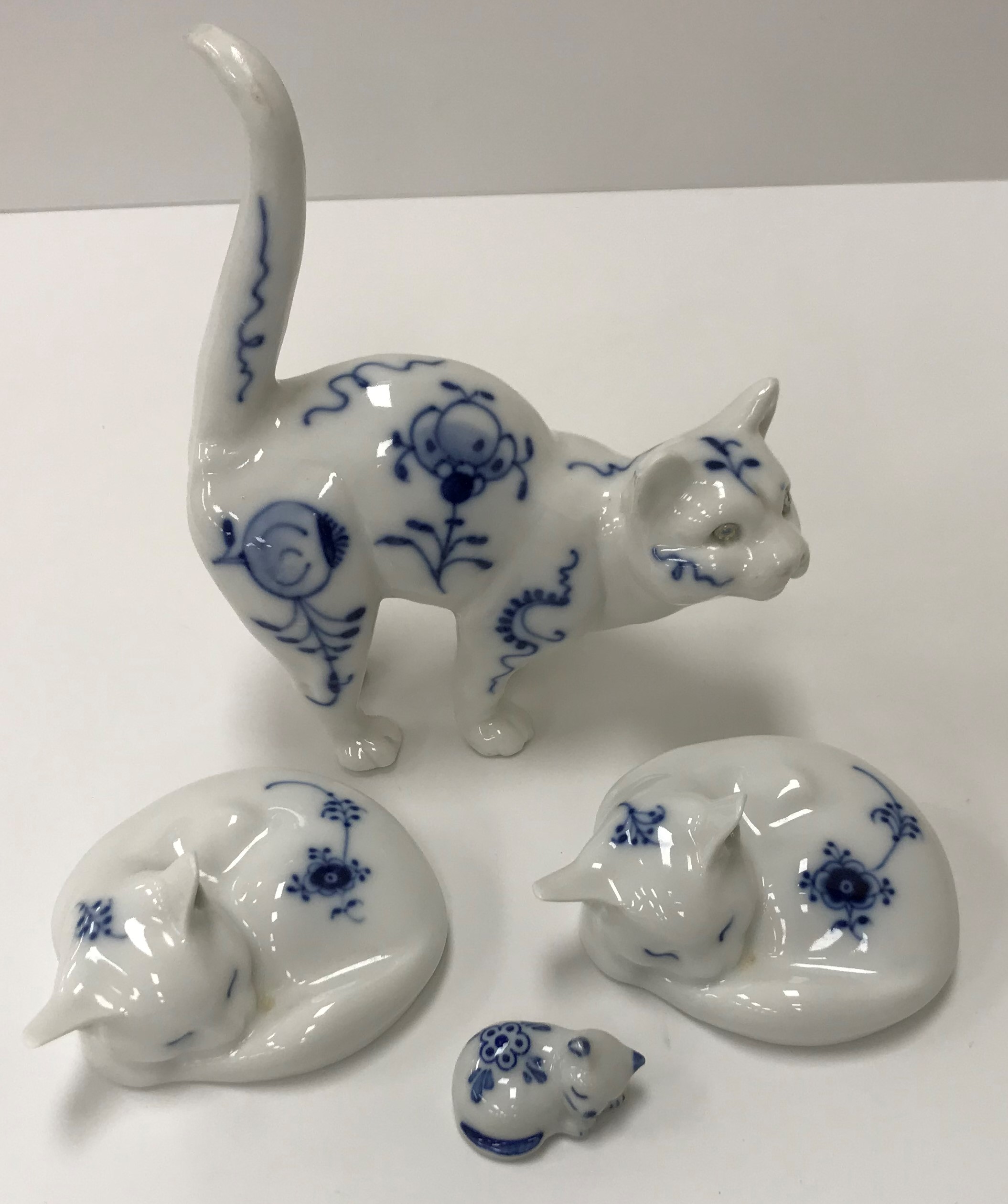 Two Royal Copenhagen onion pattern figures of "Sleeping cats" and two further onion pattern figures