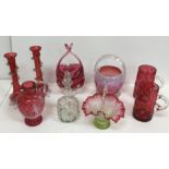 A collection of cranberry glassware to include a Mary Gregory style jug,
