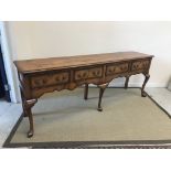 A modern North Country fruitwood and cross-banded dresser in the 18th Century style,