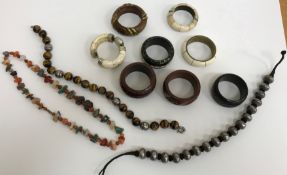 A collection of costume jewellery to include a tiger's eye and white metal beaded necklace,