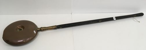 A copper coal helmet together with a 19th Century copper warming pan with ebonised handle