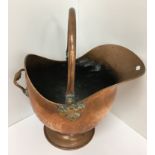 A selection of copper ware including coal helmet, kettle, coffee pot,