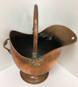 A selection of copper ware including coal helmet, kettle, coffee pot,