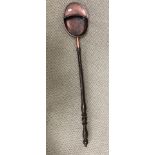 A 19th Century copper collection pan with gadrooned edging and turned wooden handle 108 cm long