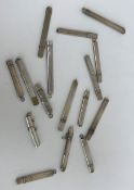 A collection of twelve silver pencil holders, all of plain form, to include one by S Morden & Co.