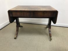 A 19th Century rosewood and cross-banded rounded rectangular drop-leaf sofa table with two frieze