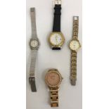 A collection of four fashion watches bearing various names comprising Fossil, Pegasus,