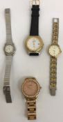 A collection of four fashion watches bearing various names comprising Fossil, Pegasus,