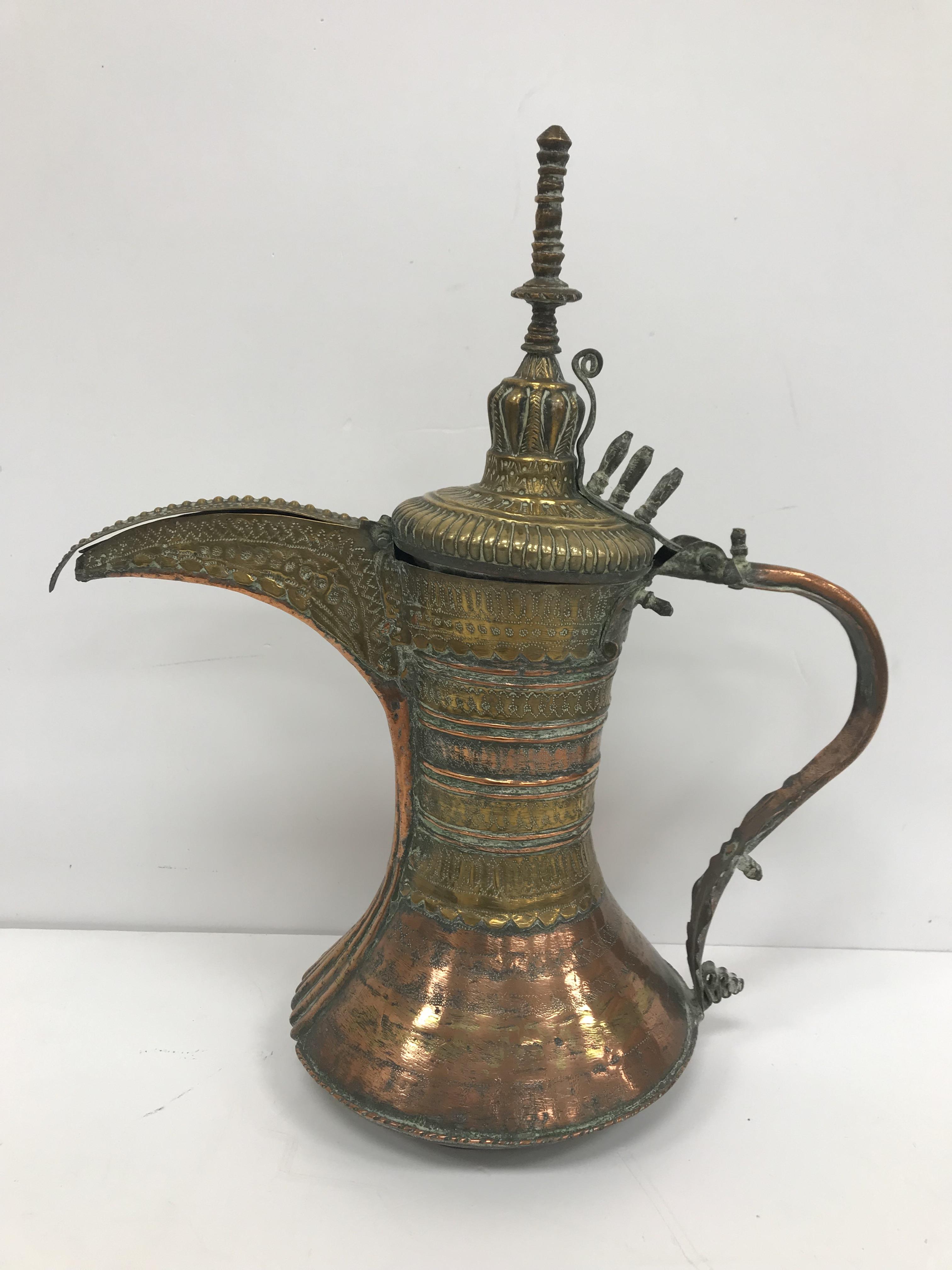 A collection of Middle Eastern and other copper wares to include two Turkish coffee pots, - Image 19 of 115