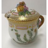 A Royal Copenhagen polychrome and gilt decorated chocolate pot with relief decorated lid inscribed