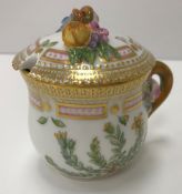 A Royal Copenhagen polychrome and gilt decorated chocolate pot with relief decorated lid inscribed