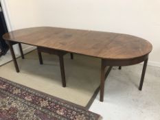 A George III mahogany D end dining table, the plain top above a plain frieze,