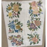 A 20th Century wool cross stitch on canvas rug with floral decoration on a cream ground,