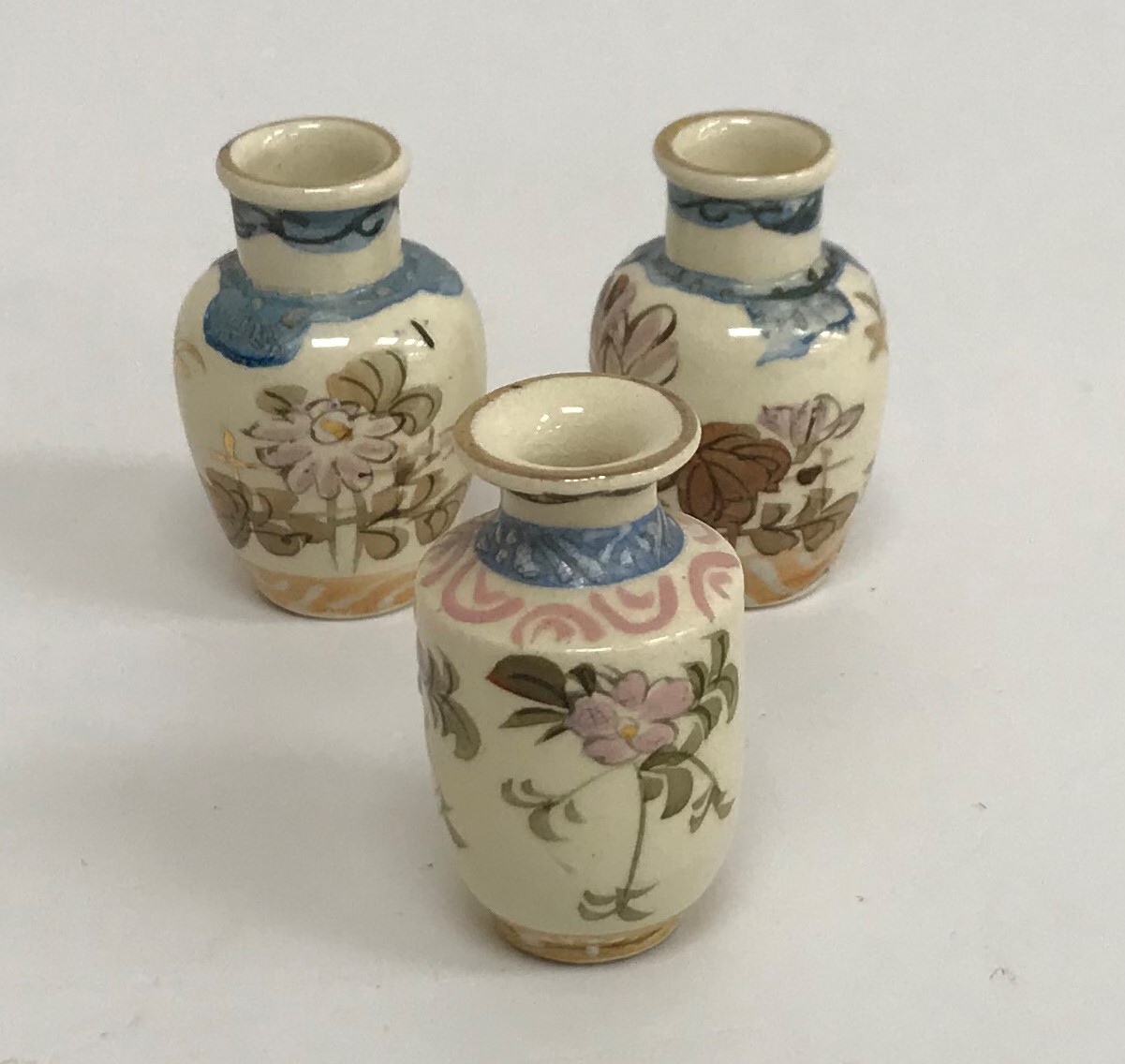 A Meiji period Satsuma pottery set of six cups and saucers with figural and costal landscape - Image 4 of 4