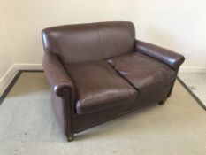 A modern brown leather upholstered "Burlington" two seat scroll arm sofa on square tapered legs in