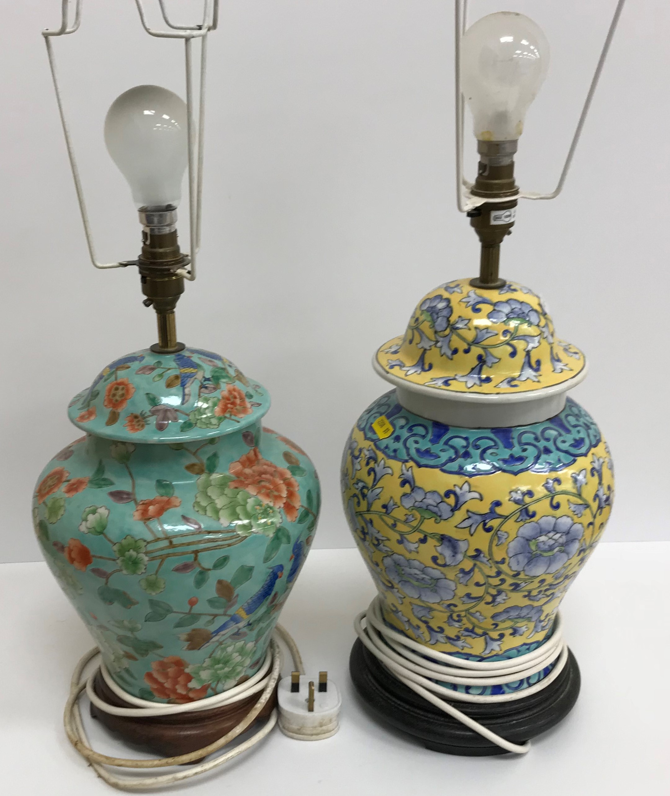 A set of three modern Chinese turquoise ground and polychrome decorated vase table lamps on wooden