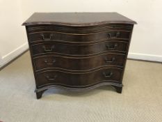 A modern mahogany serpentine fronted bachelor's chest in the George III taste,