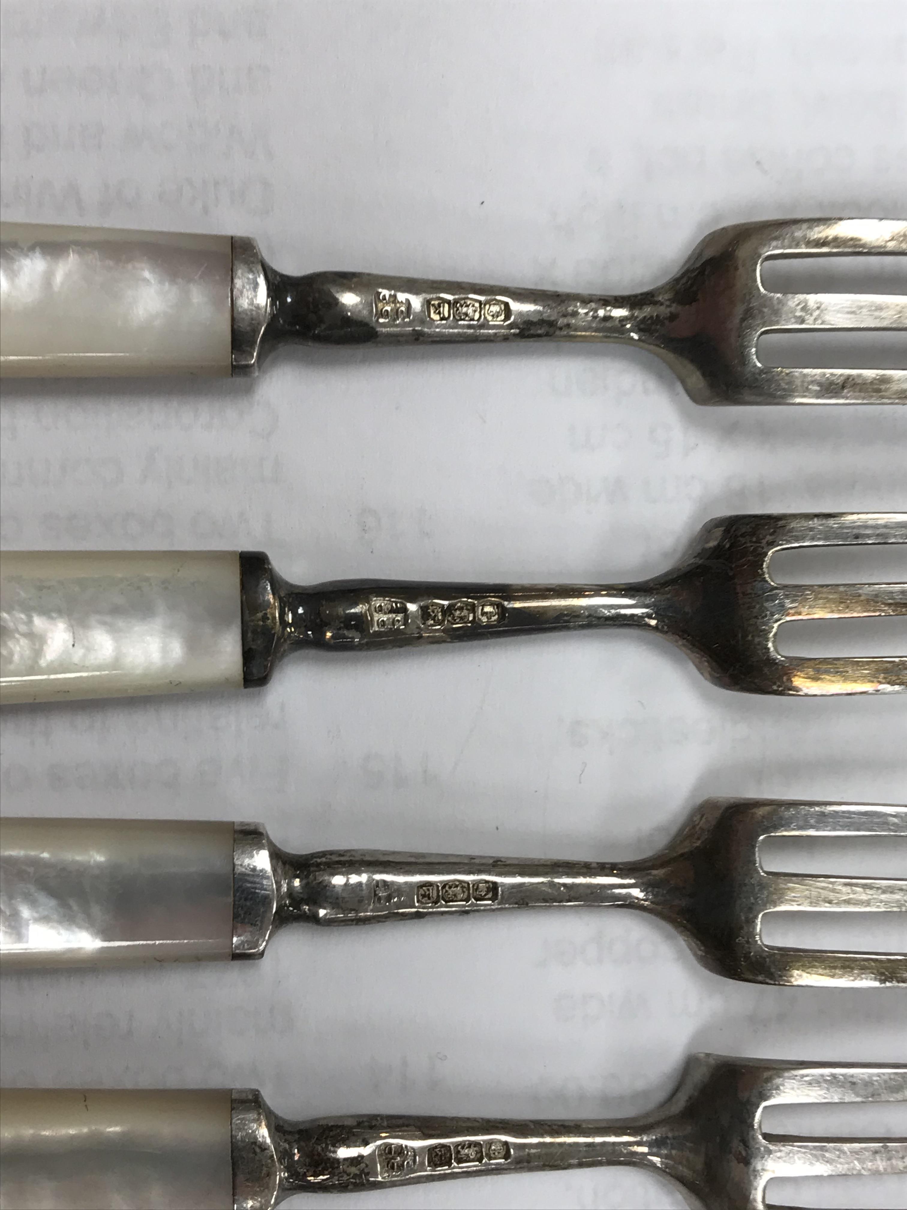 A cased set of six silver bladed and tined mother of pearl handled fruit knives and forks (by James - Image 10 of 26