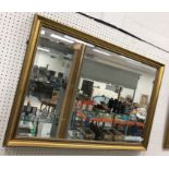 A modern gilt swept framed rectangular wall mirror with bevel edged plate, 99 cm x 69 cm,
