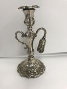 A Victorian silver chamberstick with acanthus leaf decoration and scrolling C handle,