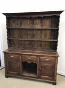 A 20th Century oak dresser in the 18th C