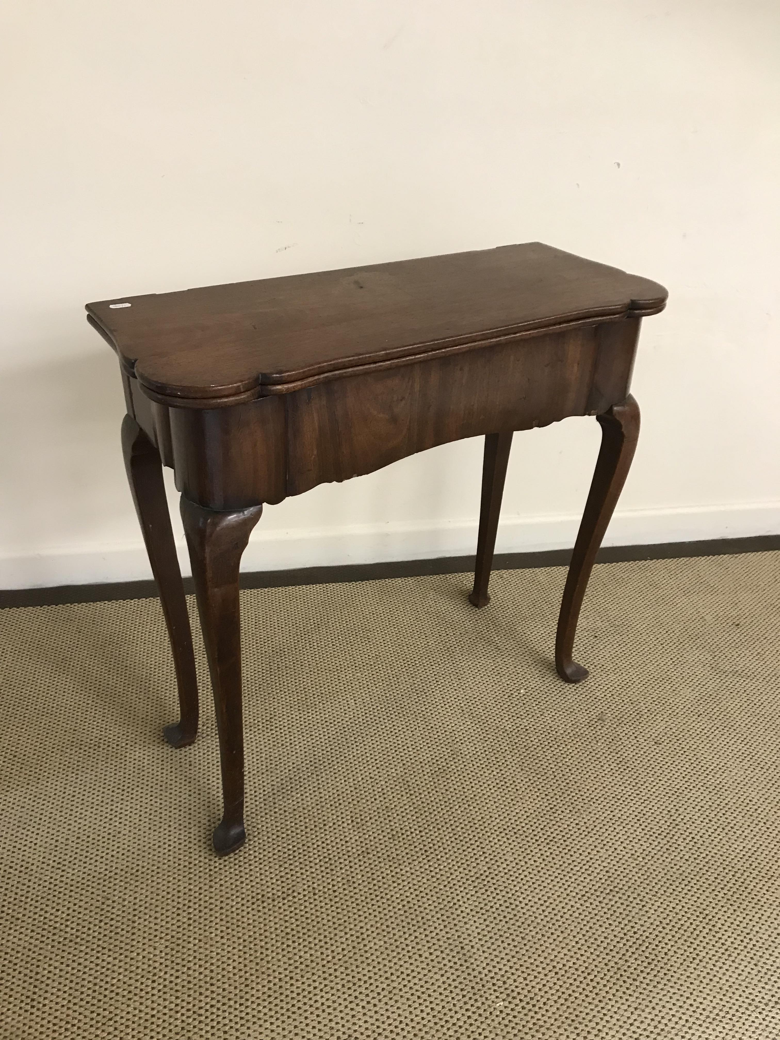 A 19th Century walnut tea table in the e