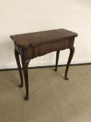 A 19th Century walnut tea table in the e