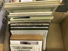 A box containing various catalogues for