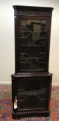 A modern reproduction mahogany corner ca