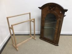 A walnut and inlaid corner cupboard in t