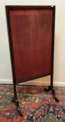 A 19th Century mahogany fire screen, the