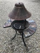 A barbecue in the form of a wishing well